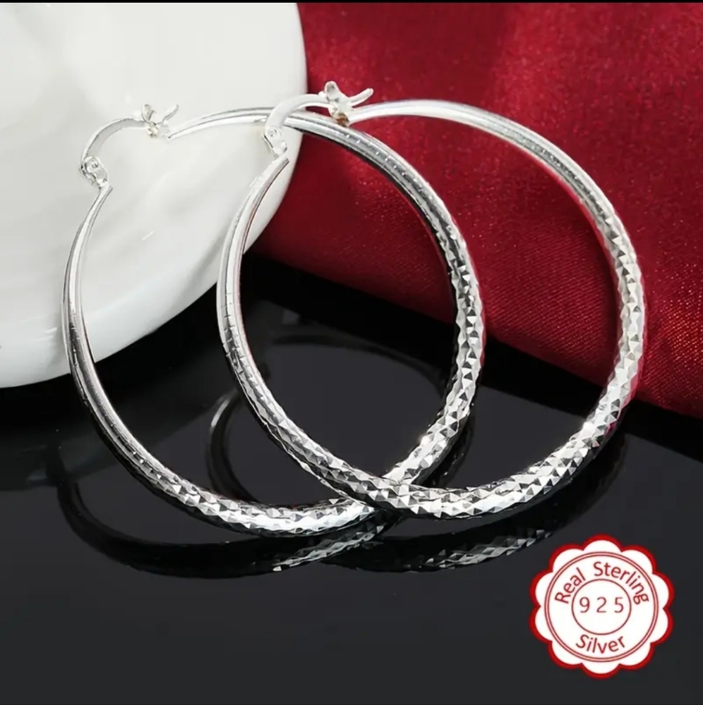Elegant Silver Hoop Earrings with Intricate Detailing